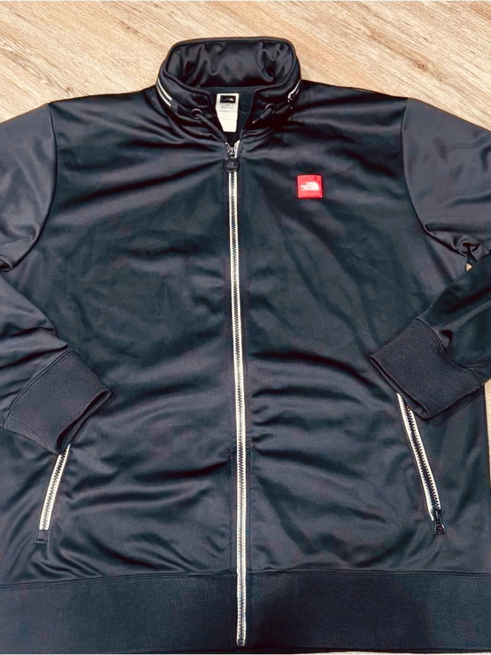 The North Face Black Jacket with Red Logo Patch
